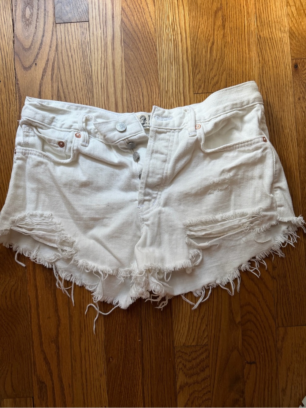We The Free White Distressed Denim Cutoff Shorts